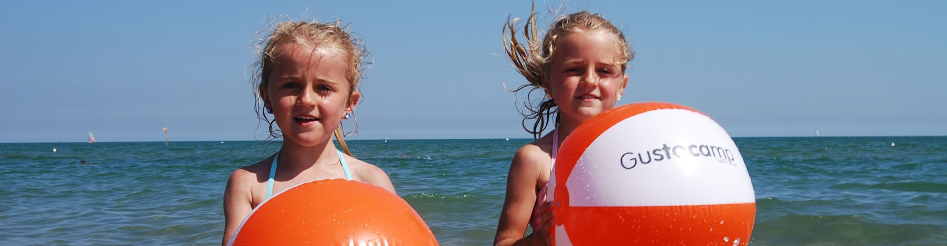 Italy - Adriatic coast - May holiday - girls with beach ball at Camping Marina di Venezia